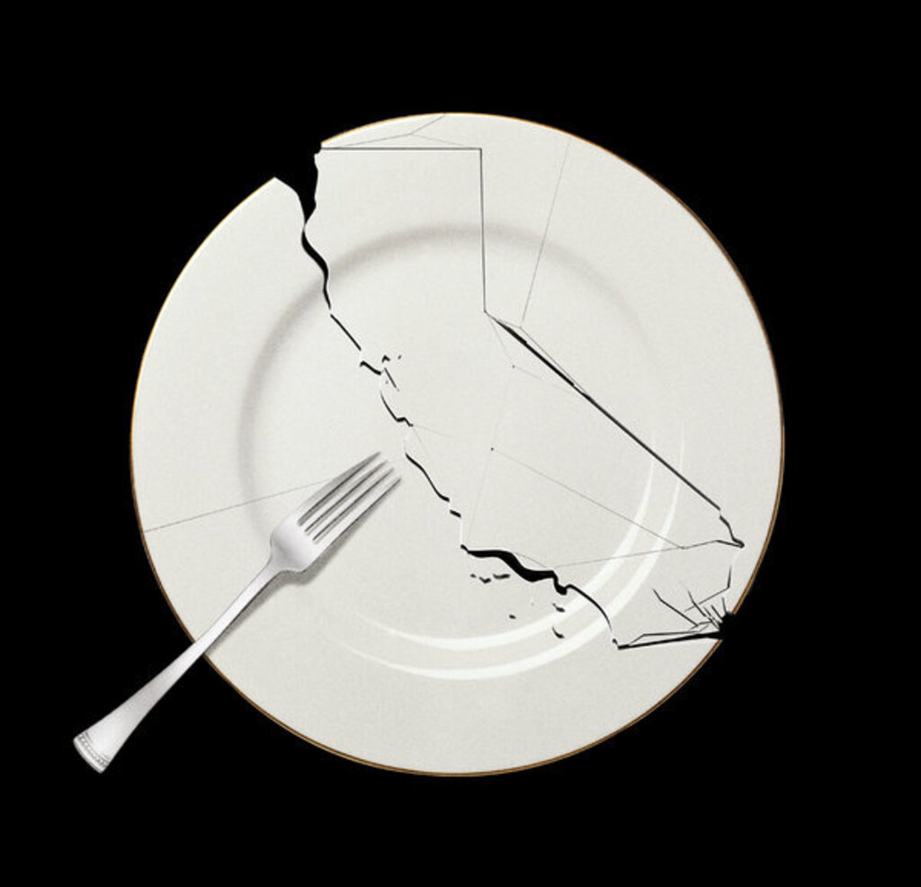 Picture of a broken plate with a fork on top