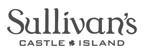 Sullivan's Castle Island logo featuring stylized text and a small shamrock symbol between the words 'Castle' and 'Island', reflecting the RealFood spirit.