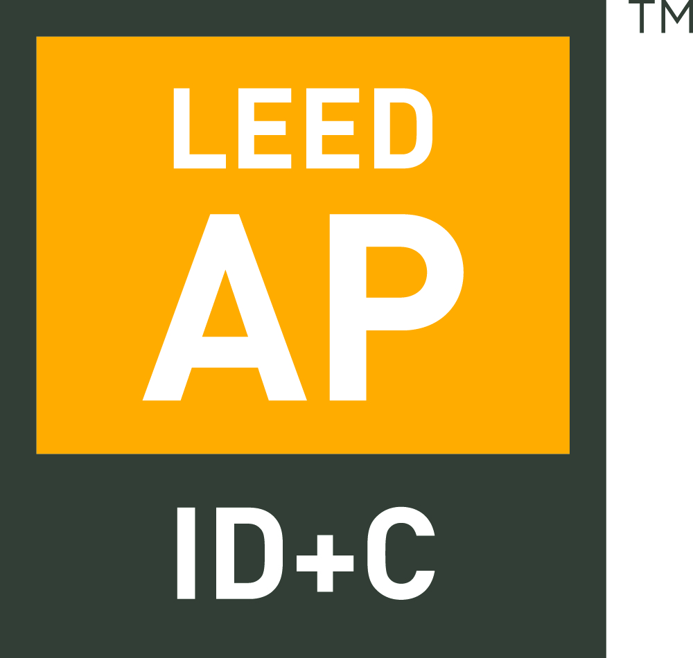 LEED AP ID+C logo featuring white text on a yellow and dark green background, indicating Guli Duran's accreditation in Interior Design and Construction.