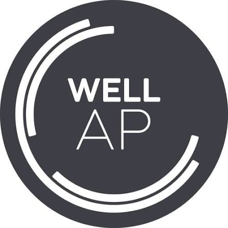 A circular dark gray logo with the text 